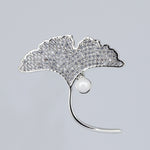 SILVER DOLLY BROOCH