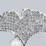 SILVER DOLLY BROOCH
